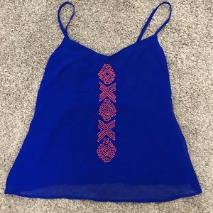 bright blue tank top with orange beads